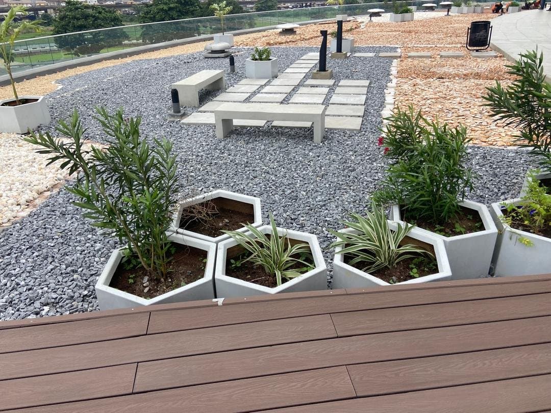 Hexagonal concrete planters with tropical foliage at the National Theatre, Lagos